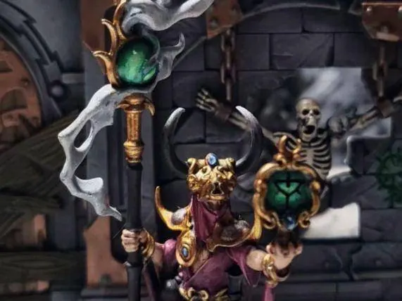 Hero Grade miniature painting: a Tzeentch sorcerer with glowing magic effects