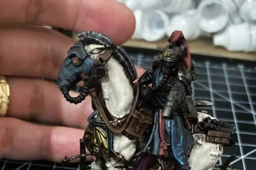 A painted test model held up for approval