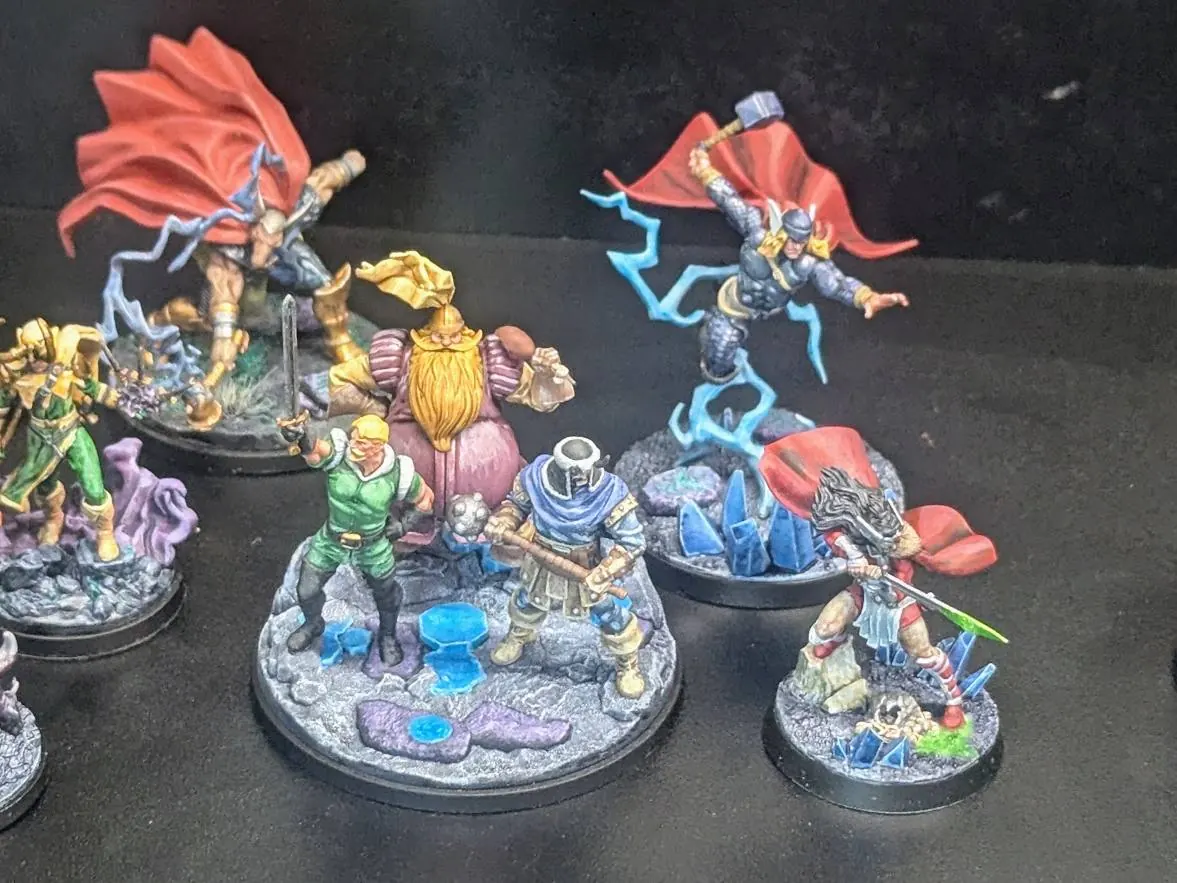 A painted Marvel Crisis Protocol roster on display