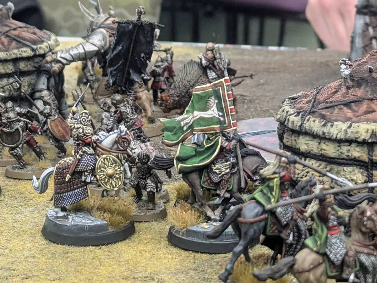 Rohan cavalry charging across a Middle-earth battlefield